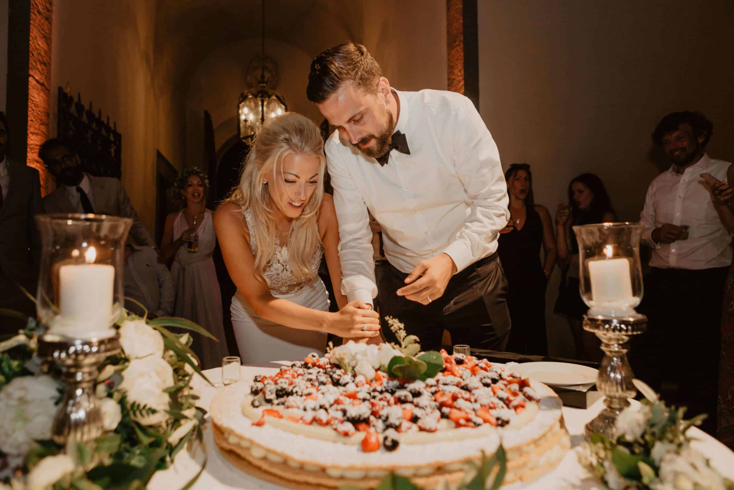 Bride and groom cut the wedding cake 
