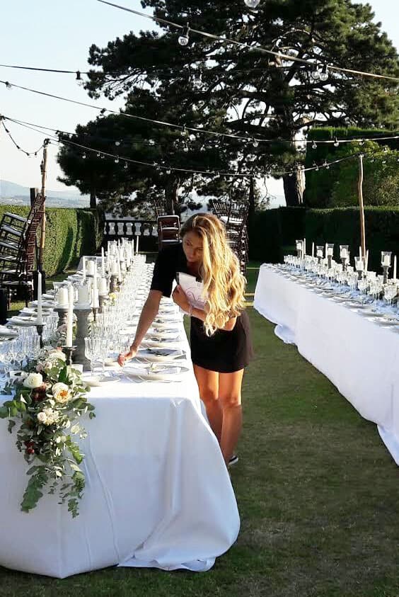 valentina is setting up the luxury wedding table