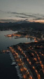 Aerial view over the Italian coastline at night.