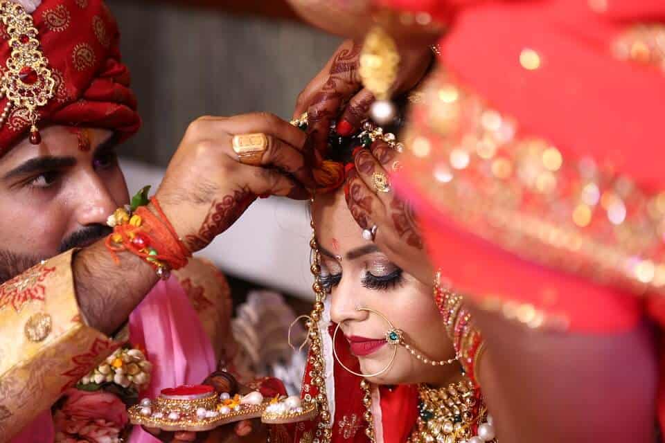 indian groom fix up brides hair