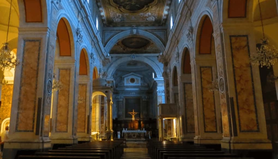 Inside view of a church with an ornate gold ceiling, showcasing the elegance of a Catholic wedding in Sorrento, Italy.
