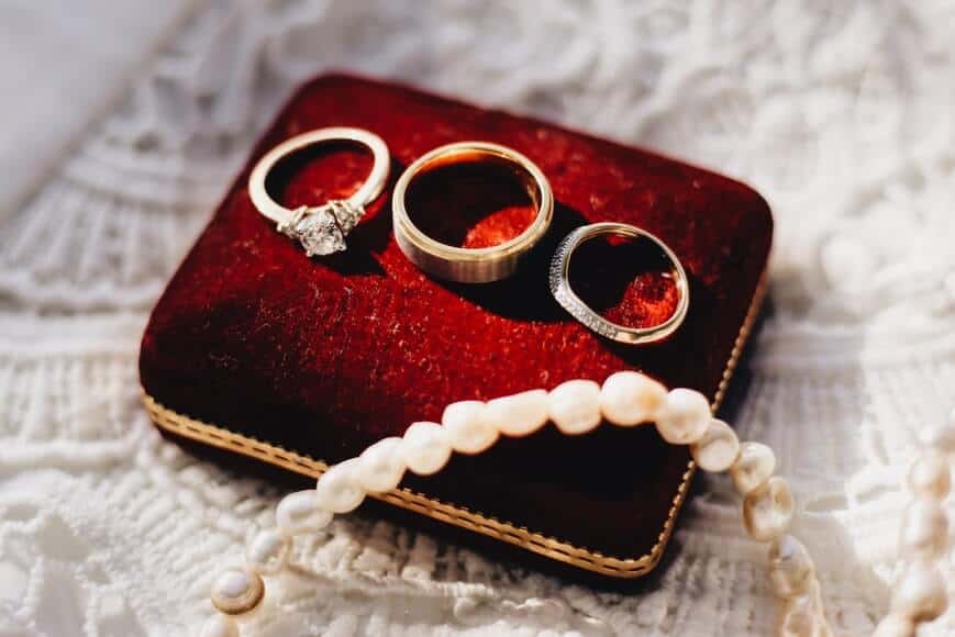 3 engagement rings on a red box