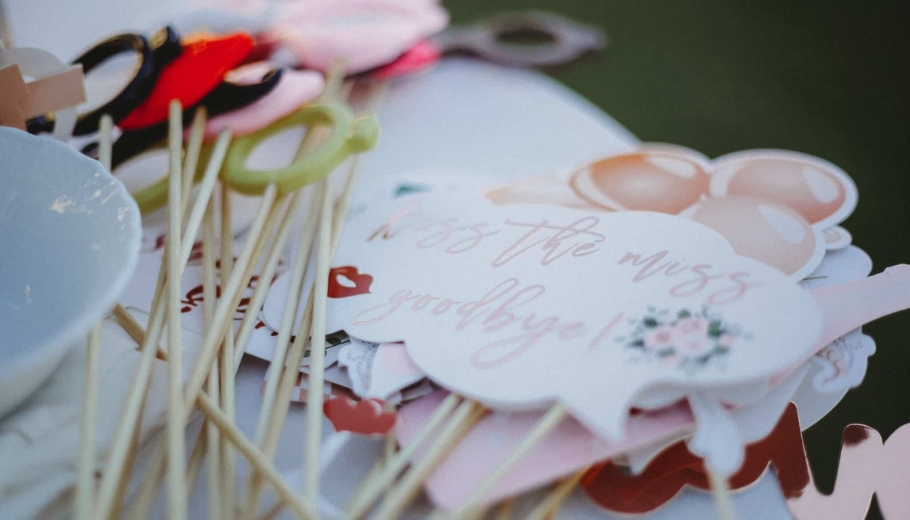 A wedding gift table featuring wooden sticks and a text, showcasing personalized decorative items.