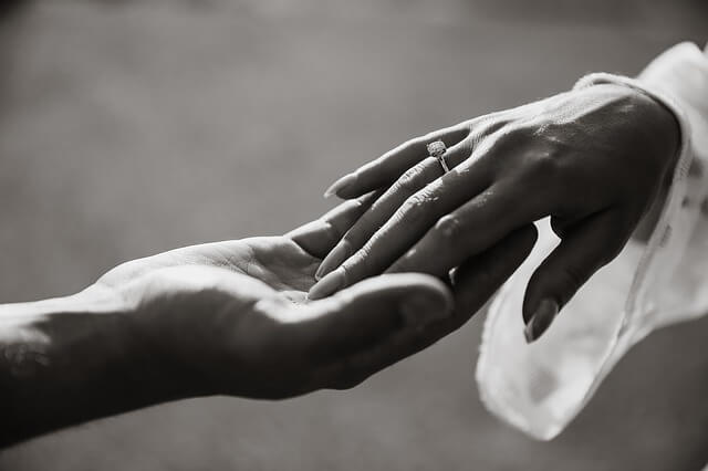 hand in hand during wedding