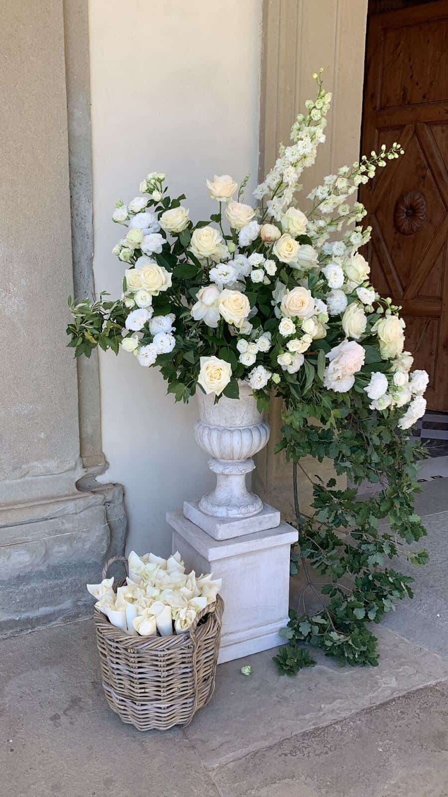 Outside church door with flowers for a Catholic Wedding In Italy