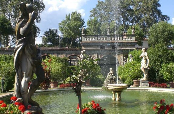 The big fountain at palazzo Pfanner with greece goddess statues, water splashes and plants 