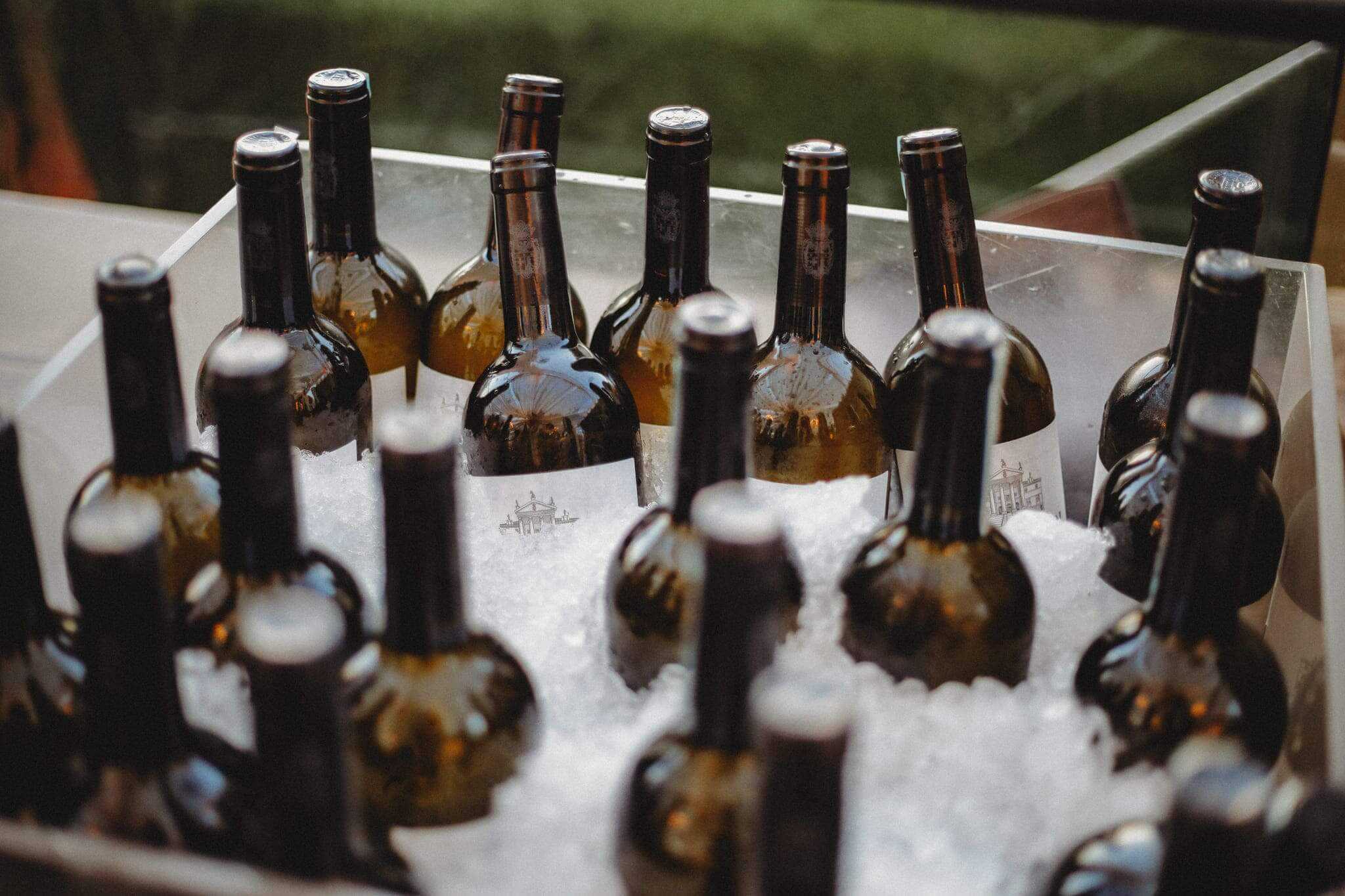 wine bottles in ice for wedding