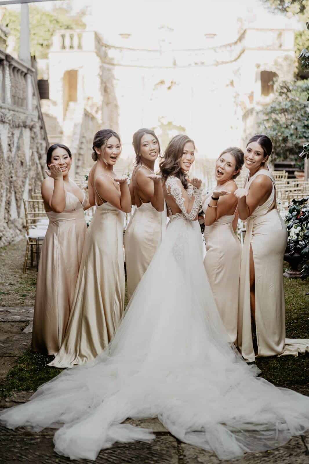 bridesmaid shows their dresses