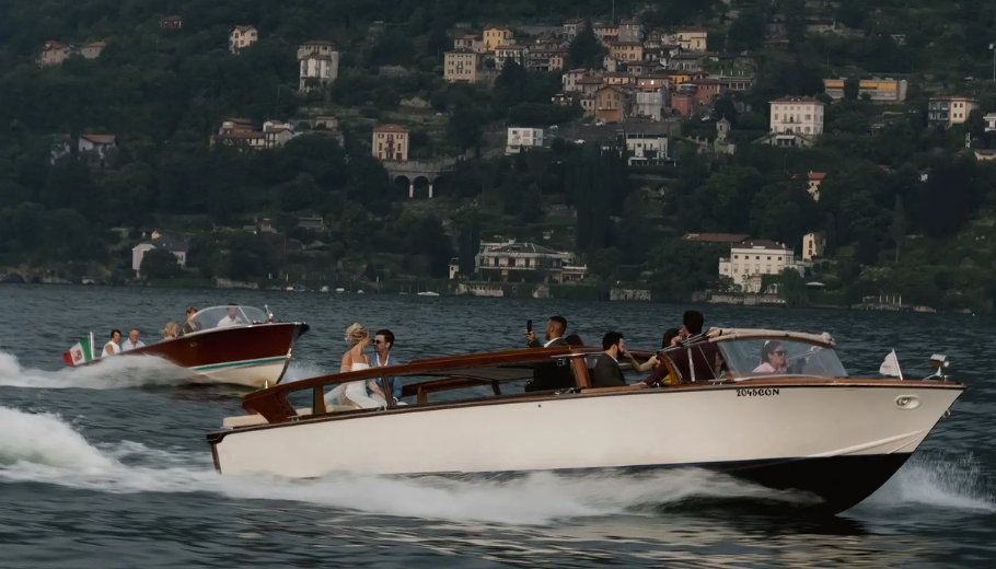 A wedding boat gliding on the serene waters of Lake Como, Italy, perfect for a romantic honeymoon experience.