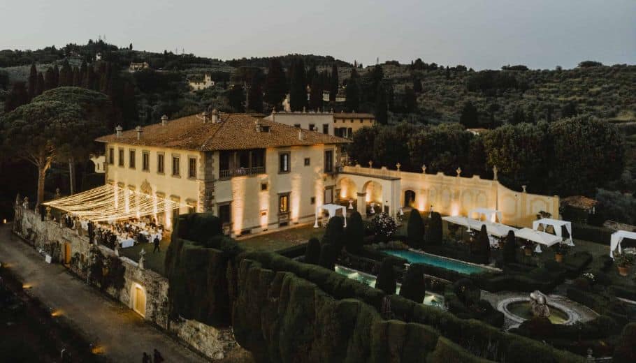 Aerial view of a Villa Gamberaia, Tuscany, showcasing its elegant architecture amidst the serene landscape, perfect for wedding venue.