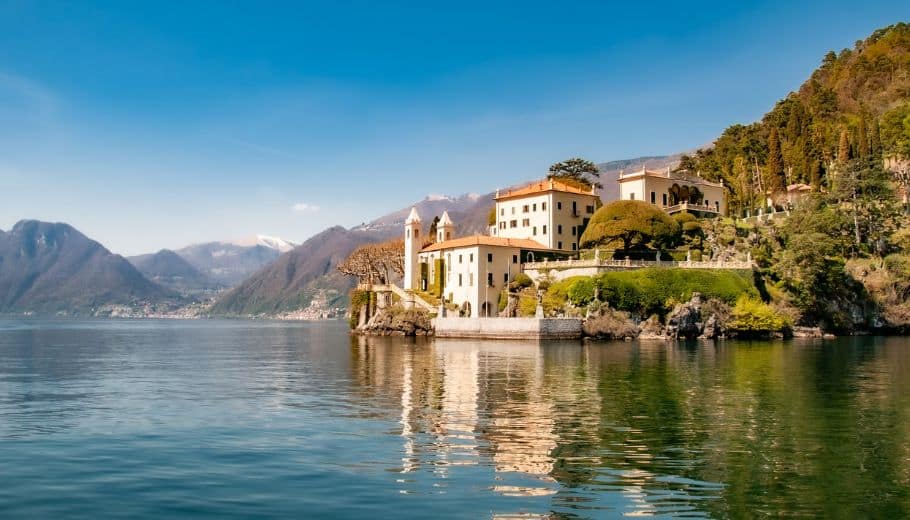 A serene lake featuring a majestic castle, perfect for a romantic Lake Como Wedding.