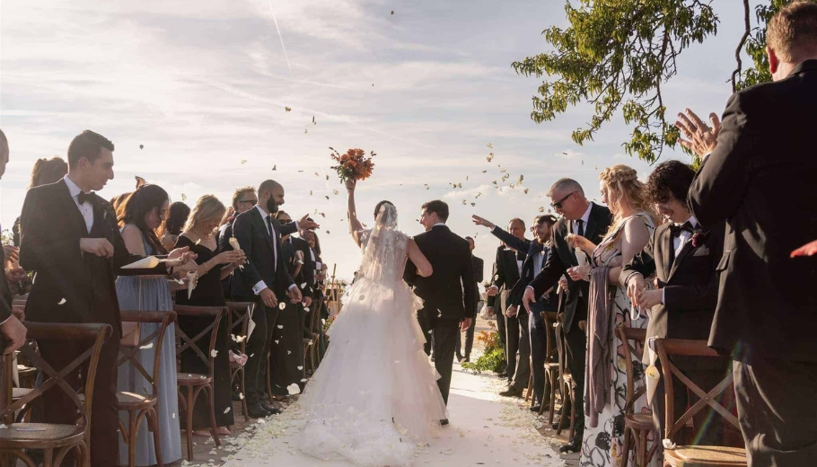 A beautiful wedding of Courtney and Joe in Florence, Italy, adorned with confetti, capturing the joy of a couple's special day.